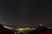 The Trident Tour Fuego Volcano with city lights Guatemala